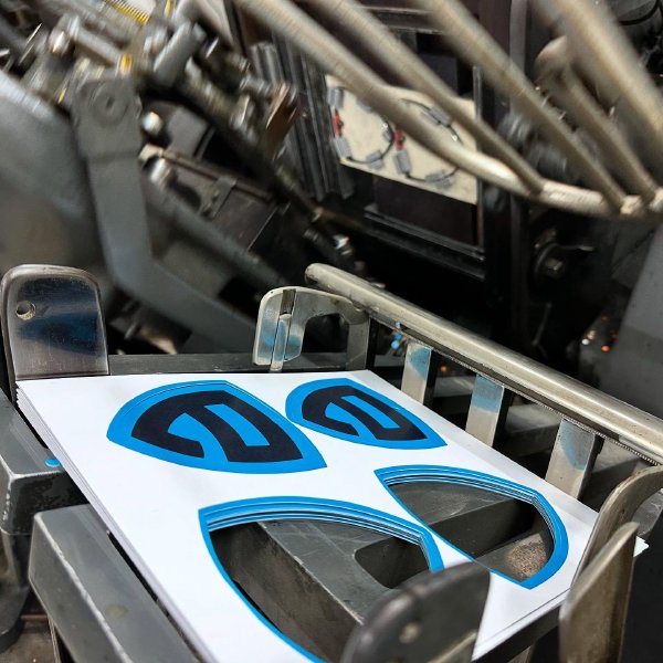 “Custom-shaped paper prints, cut with precision by our shop—making your labels and designs …